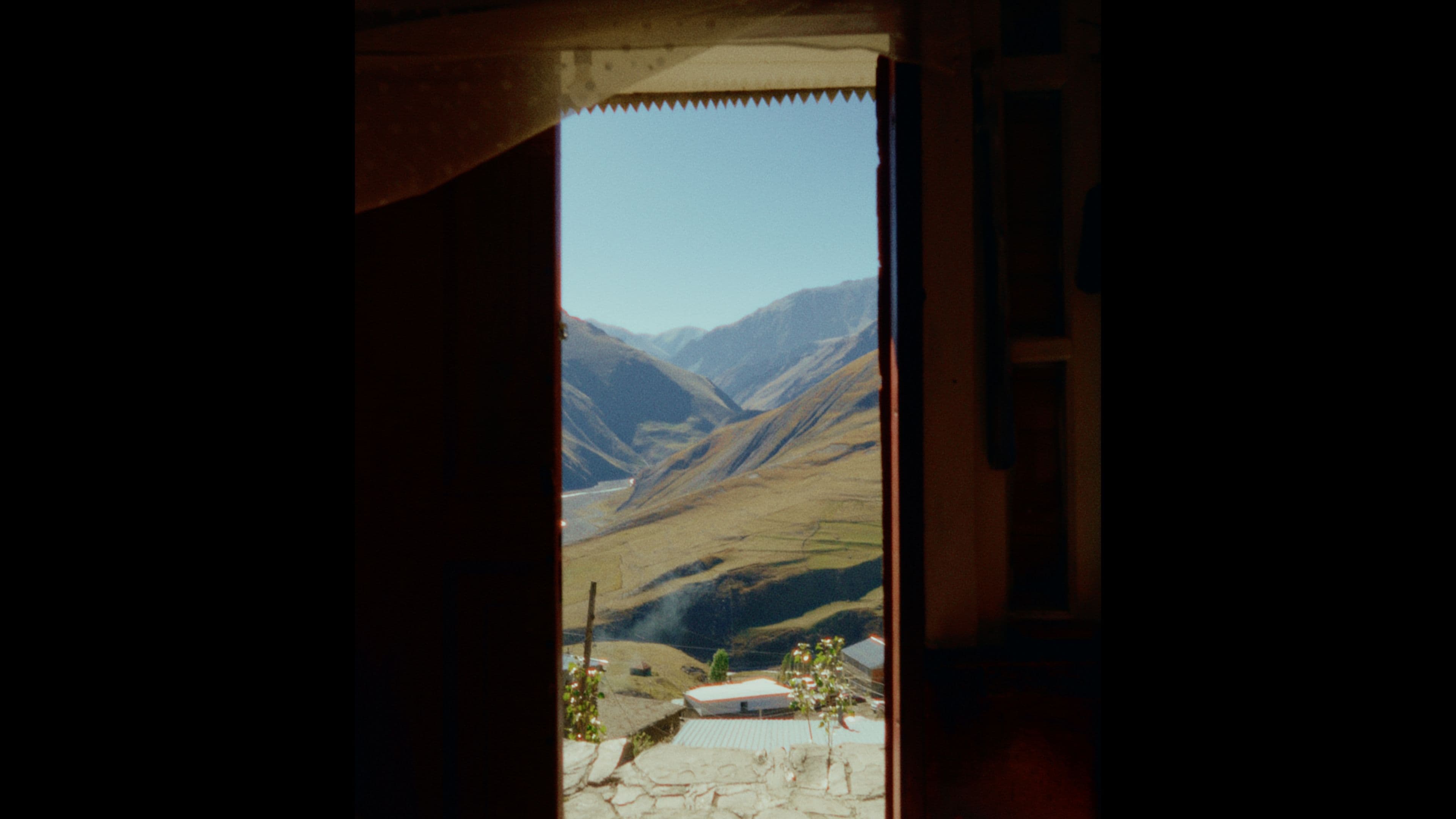 View of Baku's mountains through Akram's doorframe
